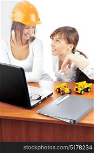 Two business women in the construction industry discuss about the job
