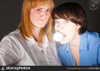 two business women with bulb, concept of creativity