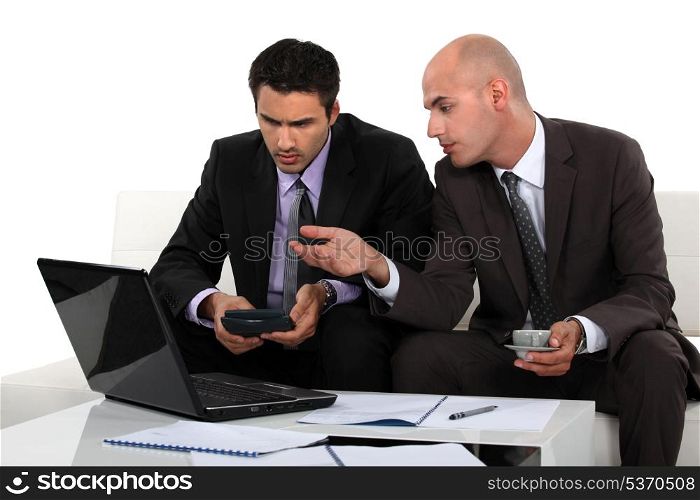 Two businessman discussing work