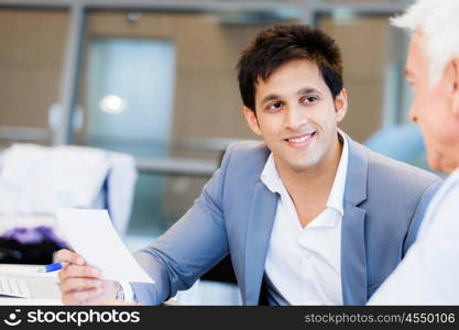 Two businessman in office having discussion. Discussion is the way to solution