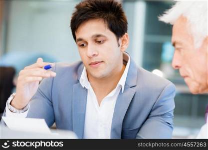 Two businessman in office having discussion. Discussion is the way to solution