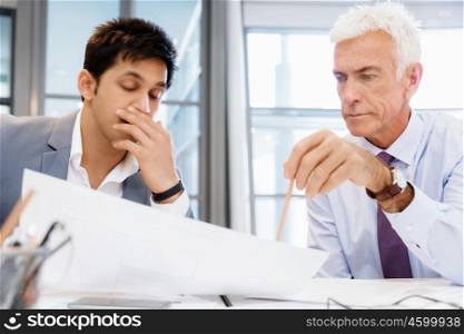 Two businessman in office having discussion. Discussion is the way to solution