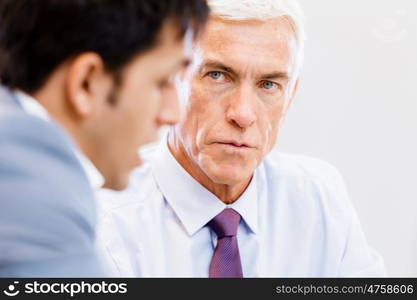 Two businessman in office having discussion. Discussion is the way to solution