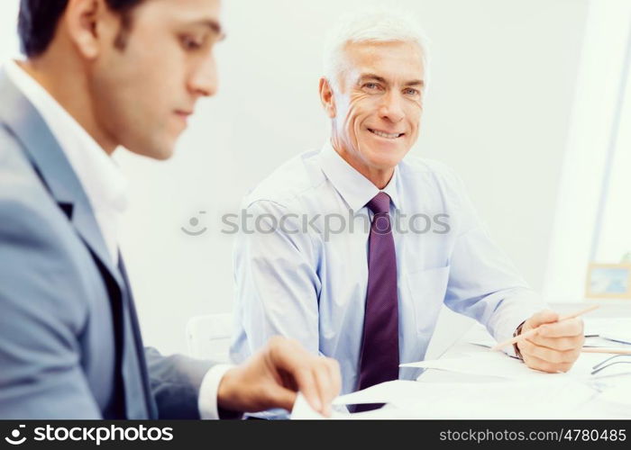 Two businessman in office having discussion. Discussion is the way to solution