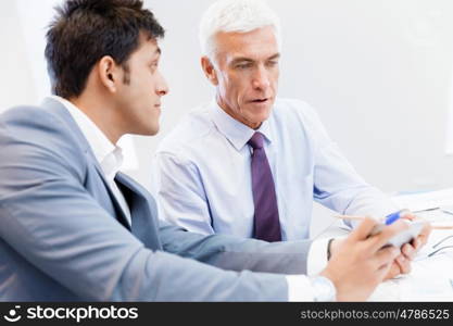 Two businessman in office having discussion. Discussion is the way to solution