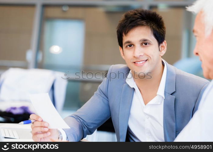 Two businessman in office having discussion. Discussion is the way to solution