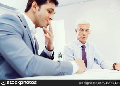 Two businessman in office having discussion. Discussion is the way to solution