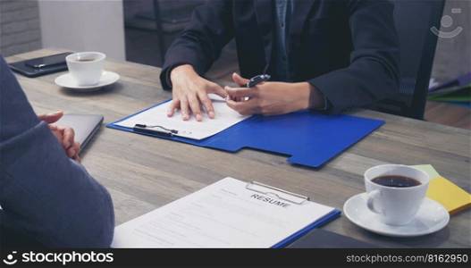 Two Businessman signing contract document start business agreement dealing teamwork. Close up hand young man colleagues  meeting mergers and acquisitions business. Partners Signed document at office.