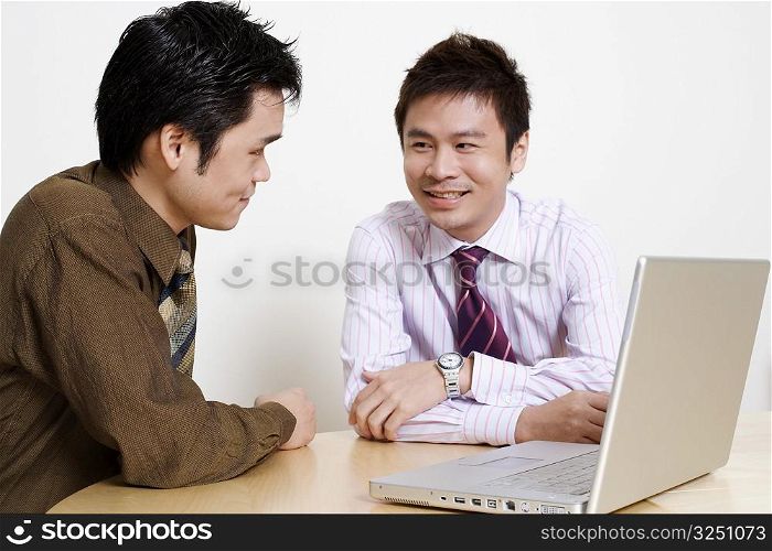 Two businessmen discussing