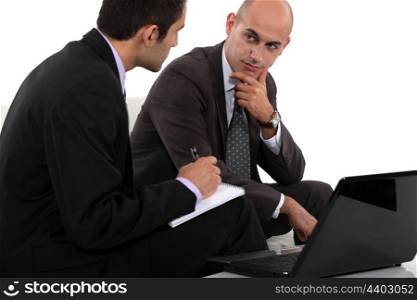 Two businessmen discussing project
