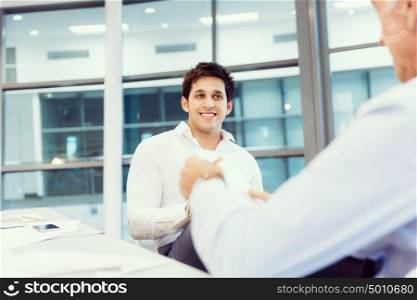 Two businessmen during interview in office. Doing business is about people