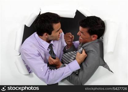 Two businessmen fighting