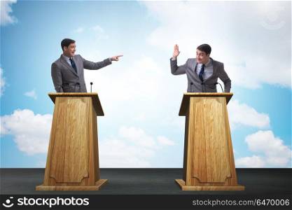 Two businessmen having heated discussion at panel discussion