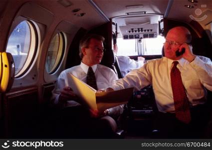 Two businessmen in a private plane