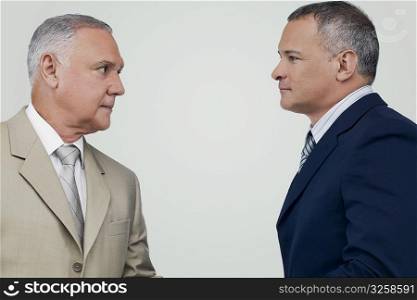 Two businessmen looking at each other