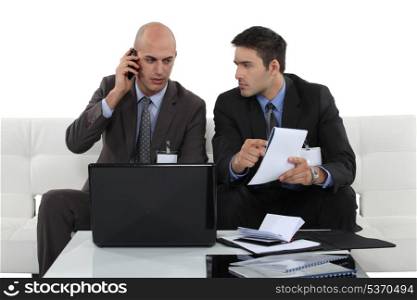 two businessmen preparing a deal