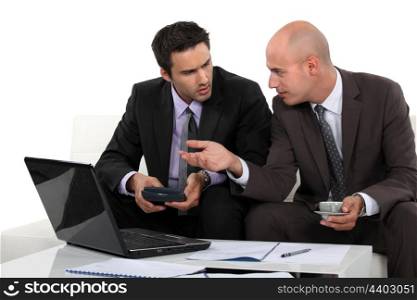Two businessmen preparing proposal