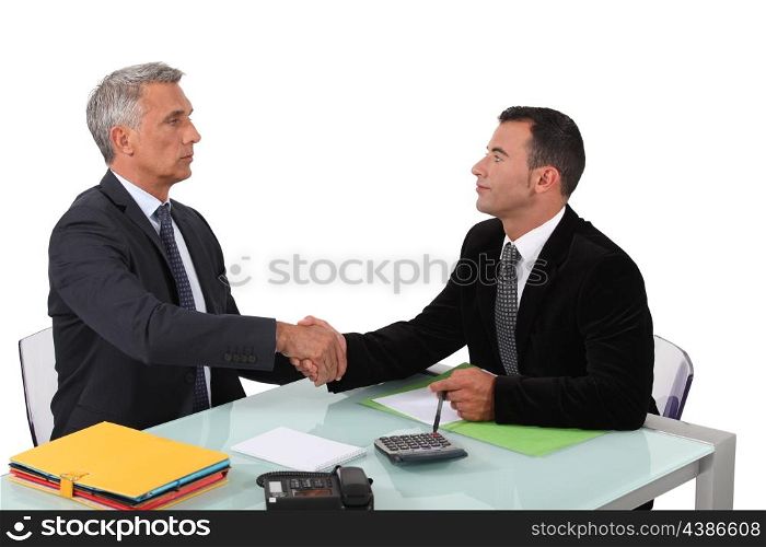 Two businessmen sealing the deal.