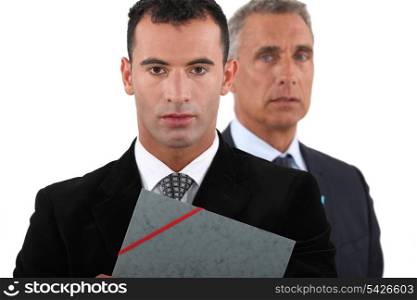 Two businessmen with folder
