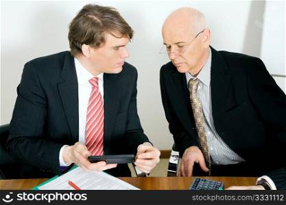 Two businesspeople crunching the numbers