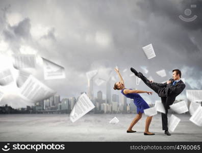 Two businesspeople in anger fighting with each other. Extreme office quarrel