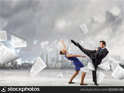 Two businesspeople in anger fighting with each other. Extreme office quarrel
