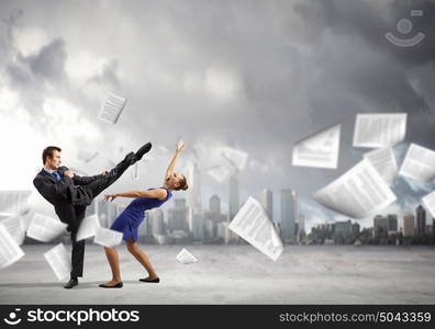 Two businesspeople in anger fighting with each other. Extreme office quarrel