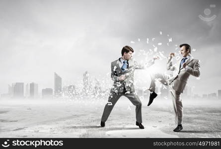 Two businesspeople in anger fighting with each other. Extreme quarrel