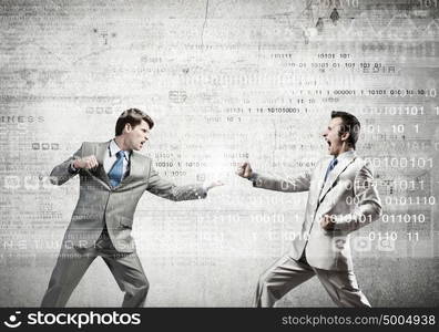 Two businesspeople in anger fighting with each other. Extreme quarrel