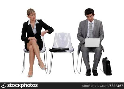 Two businesspeople waiting