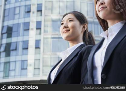 Two Businesswomen In Front of CityScape