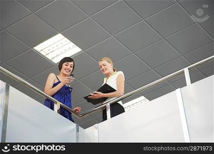 Two Businesswomen in Meeting on Balcony