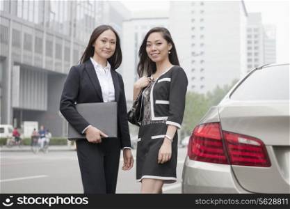 Two Businesswomen Standing On Road