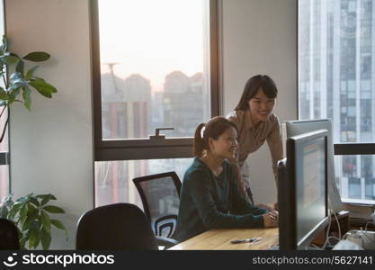 Two Businesswomen Working Together in the Office