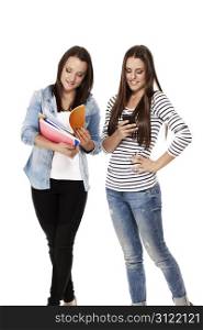 two busy students. two busy students one with notepads one with smartphone on white background
