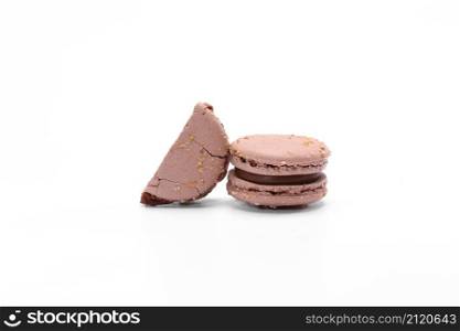 two cake of macaron or macaroon brown chocolate color. Delicious macaroon isolated on white background. French sweet cookie. two cake of macaron or macaroon brown chocolate color. Delicious macaroon isolated on white background. French sweet cookie.