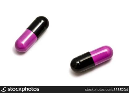 Two capsules isolated on white background