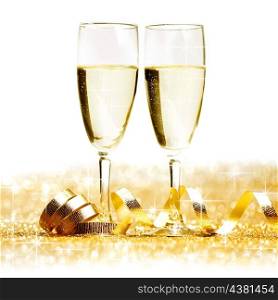 Two champagne glasses and decoration on golden background