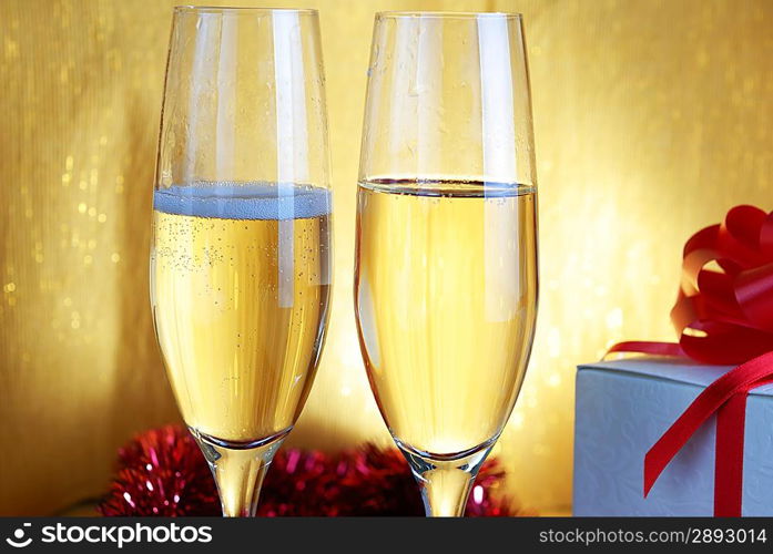 two champagne glasses on celebratory table