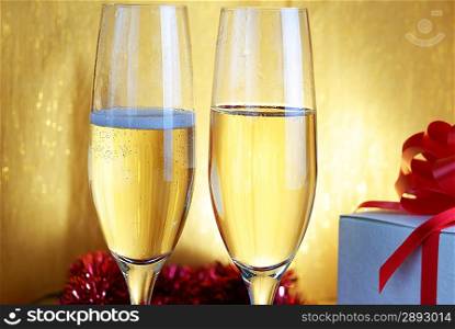 two champagne glasses on celebratory table