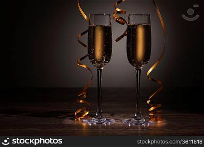 Two champagne glasses ready to bring in the New Year