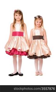 Two charming little girls in a dress. Isolated