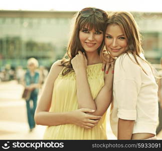 Two cheerful girlfriends with summer make-up