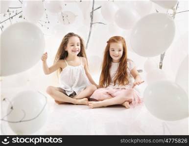 Two cheerfull girls playing together