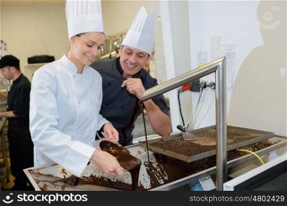 two chefs in a cooking school