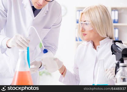 Two chemists having discussion in lab