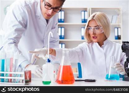 Two chemists having discussion in lab