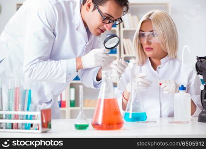 Two chemists having discussion in lab