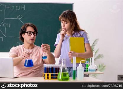 Two chemists students in classroom 