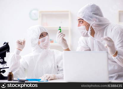 Two chemists working in the lab